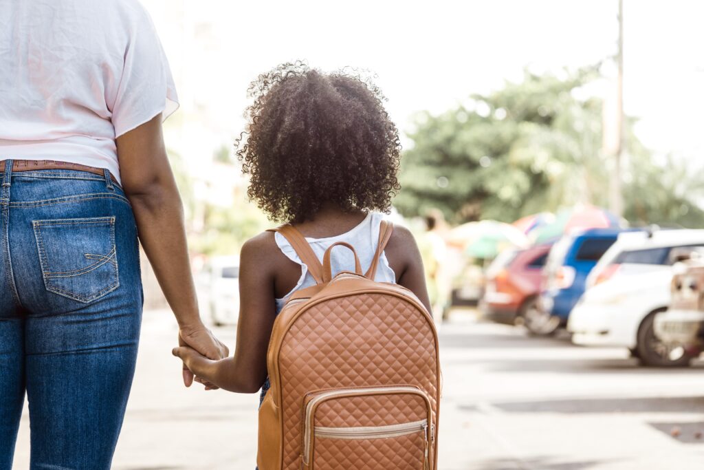 2nd grade girl with backpack on